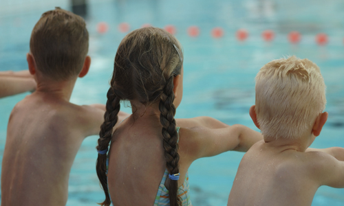 Children having a swimming lesson